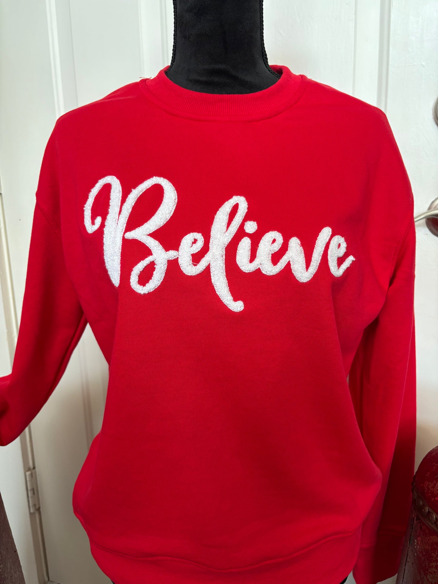 Believe sweater