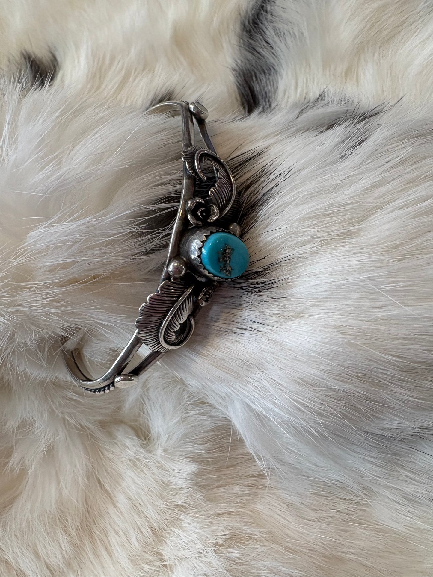 Natural turquoise feather